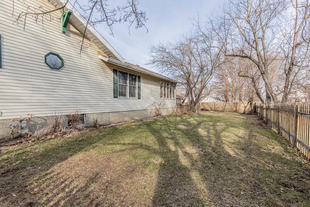 view of yard with a fenced backyard