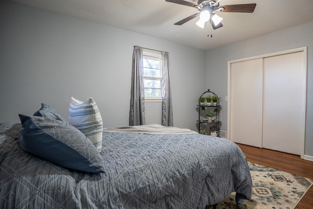 bedroom featuring a closet, a ceiling fan, and wood finished floors