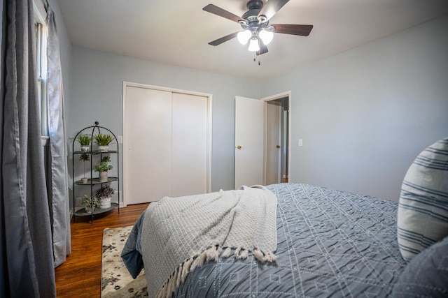 bedroom with a closet, a ceiling fan, and wood finished floors