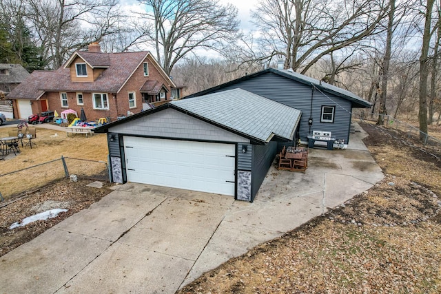 exterior space featuring fence and driveway