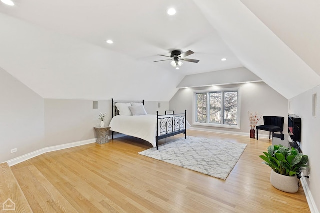 bedroom featuring lofted ceiling, recessed lighting, wood finished floors, a ceiling fan, and baseboards