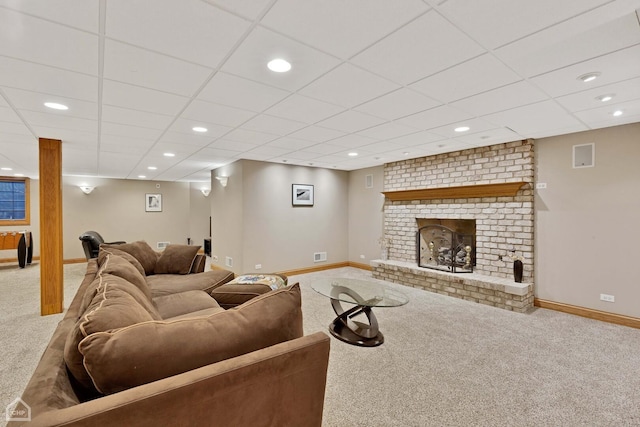 living area featuring recessed lighting, a brick fireplace, carpet flooring, and baseboards