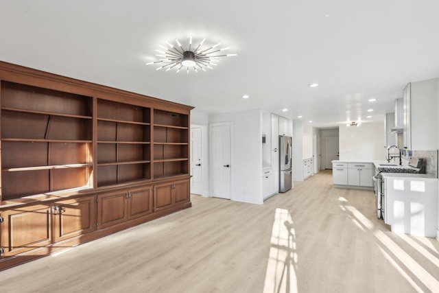 living room featuring light wood-type flooring, a chandelier, and recessed lighting