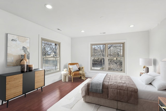 bedroom featuring recessed lighting, multiple windows, and hardwood / wood-style flooring