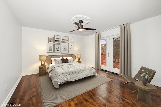 bedroom featuring baseboards, french doors, wood finished floors, and access to exterior