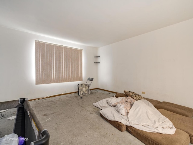 bedroom featuring baseboards and carpet floors