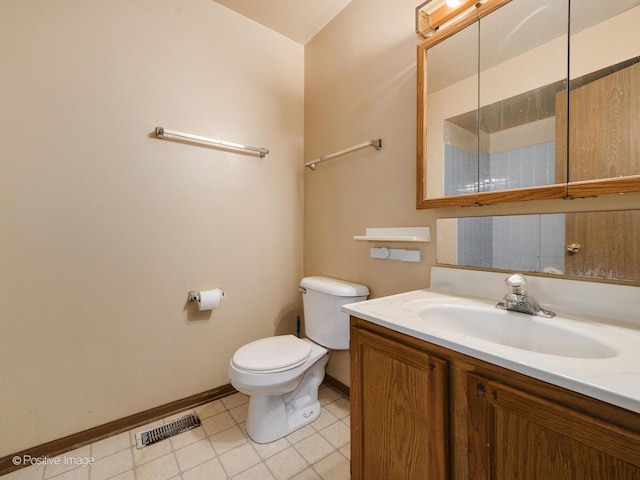 bathroom with tile patterned flooring, visible vents, baseboards, toilet, and vanity