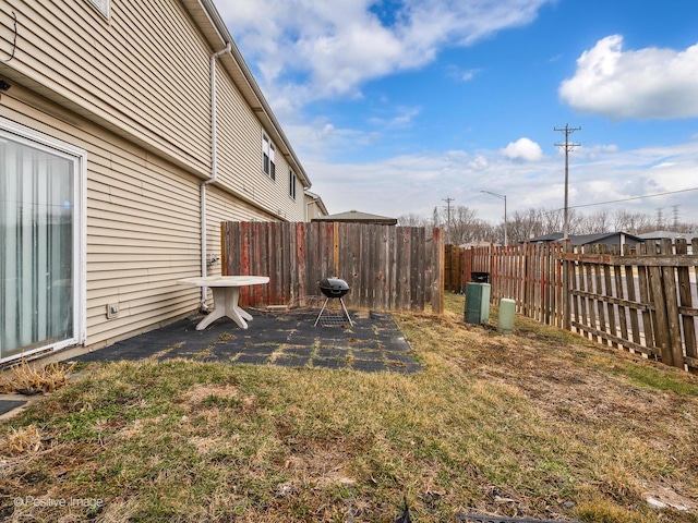 view of yard with a patio area and a fenced backyard