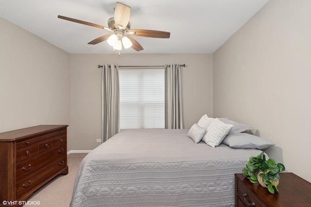 bedroom featuring carpet, a ceiling fan, and baseboards