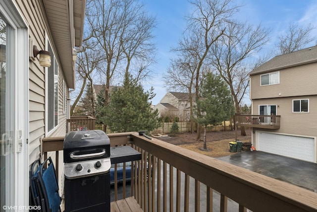 wooden deck featuring grilling area