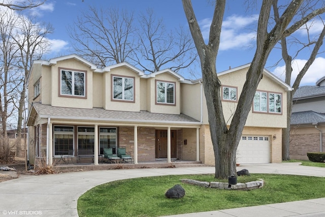 view of front of property featuring a garage, concrete driveway, stucco siding, covered porch, and brick siding