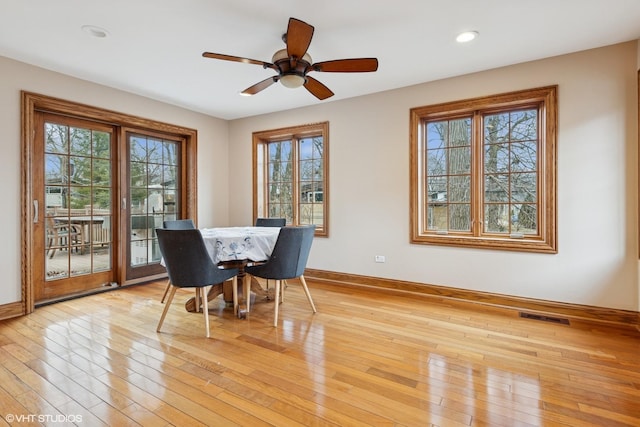 dining room with recessed lighting, visible vents, light wood-style flooring, and baseboards