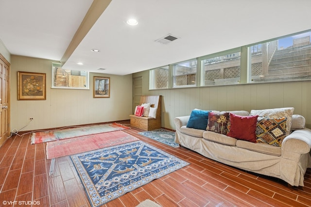 living room with recessed lighting, visible vents, and wood tiled floor