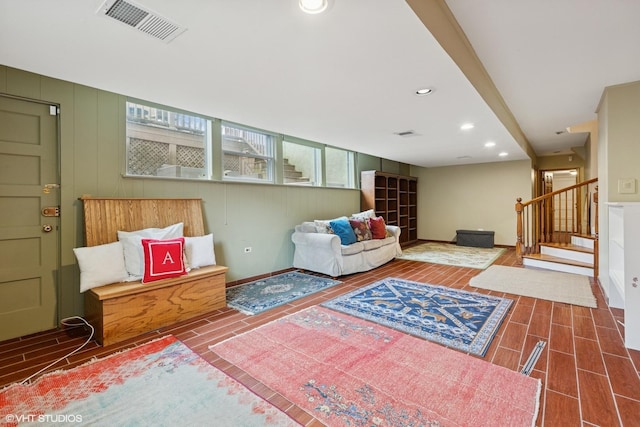 sitting room featuring recessed lighting, visible vents, stairway, wood tiled floor, and baseboards