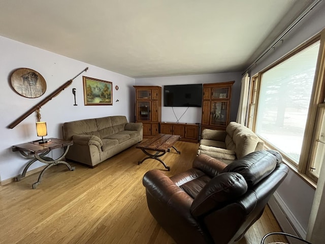 living room featuring light wood-style floors and baseboards