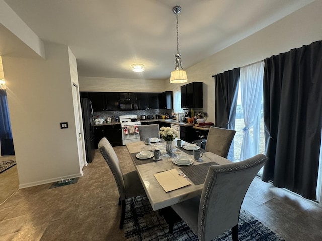 dining room featuring baseboards