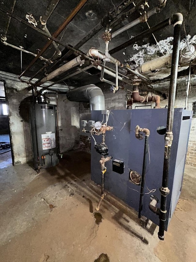 utility room with gas water heater