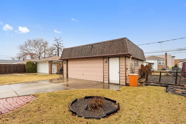 view of front facade featuring roof with shingles, mansard roof, a front yard, fence, and a garage