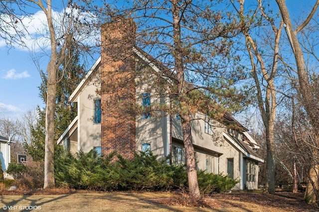 view of home's exterior featuring a chimney