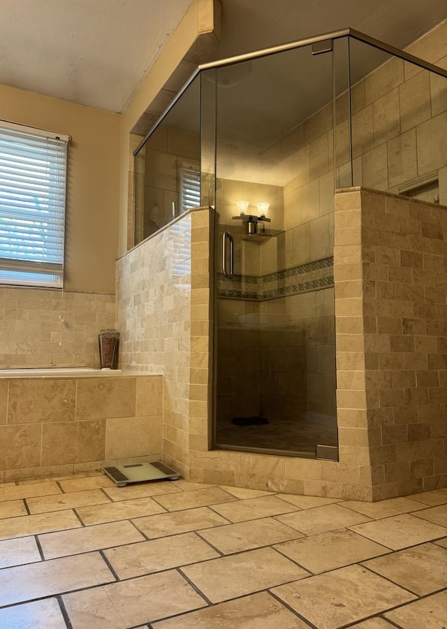 full bathroom featuring a shower stall