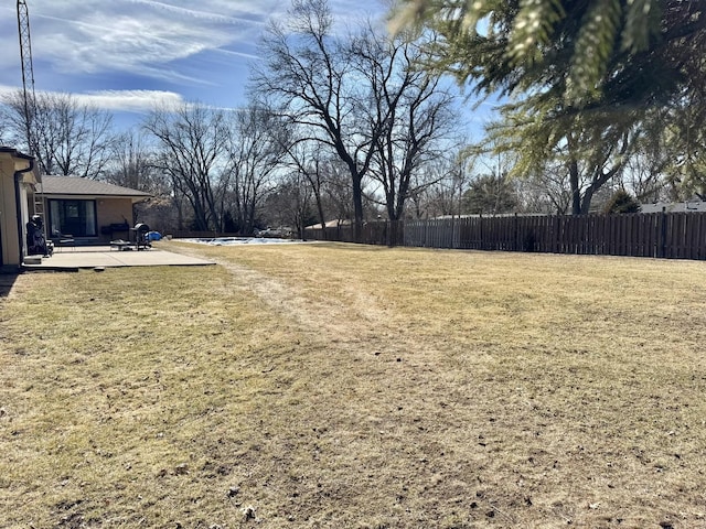 view of yard with a patio and fence