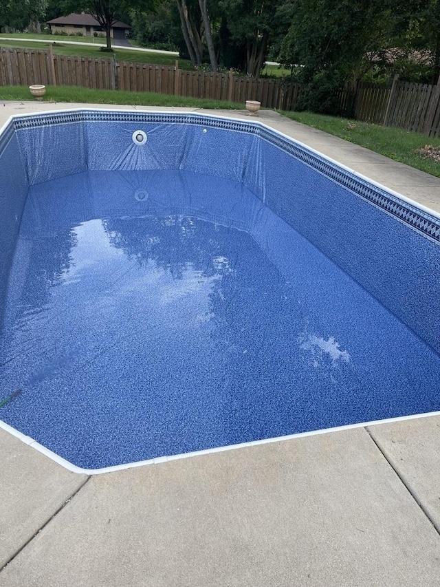 view of swimming pool with a fenced in pool and a fenced backyard