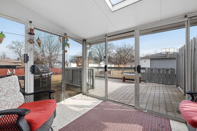 sunroom featuring a skylight