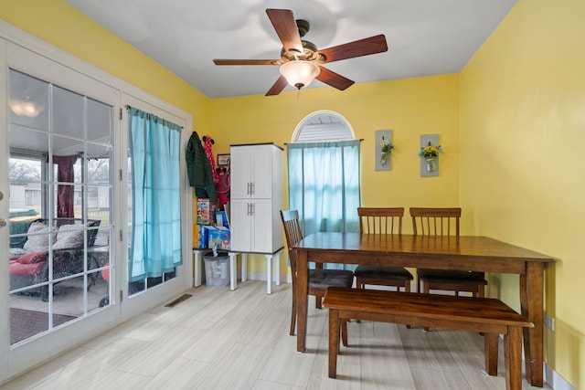 dining area featuring a ceiling fan and visible vents