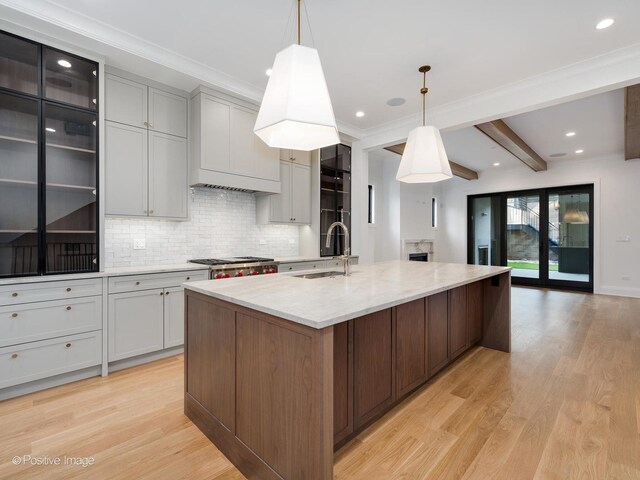 2832 N Racine Ave Unit 1E, Chicago, IL 60657 - kitchen featuring double oven range, decorative backsplash, and light stone countertops