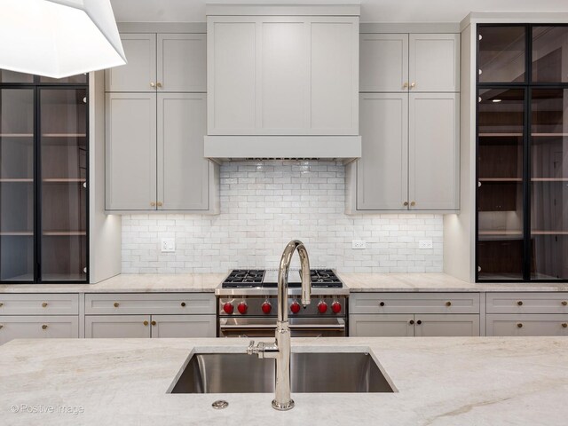 2832 N Racine Ave Unit 1E, Chicago, IL 60657 - kitchen with ornamental molding, decorative backsplash, gray cabinets, a sink, and recessed lighting