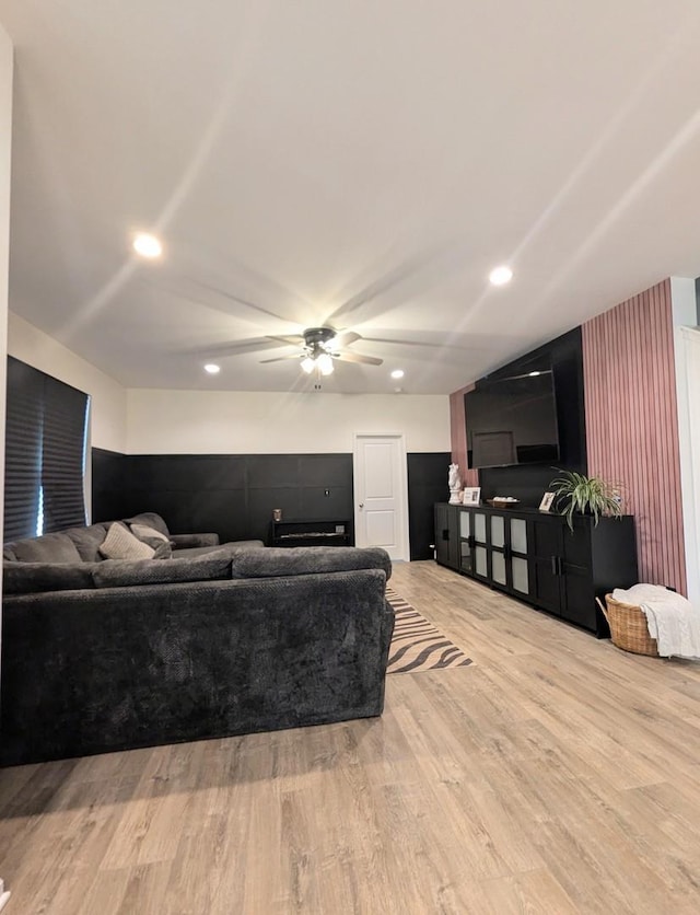 living area with recessed lighting, wood finished floors, and ceiling fan