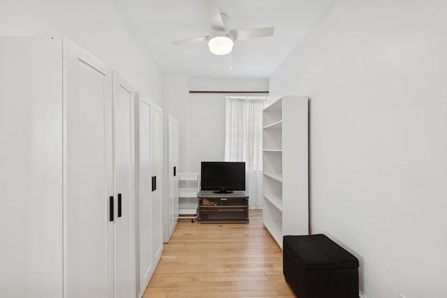 interior space with light wood-style floors and ceiling fan