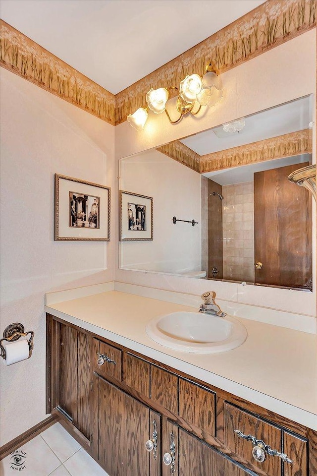 bathroom featuring tile patterned flooring and vanity