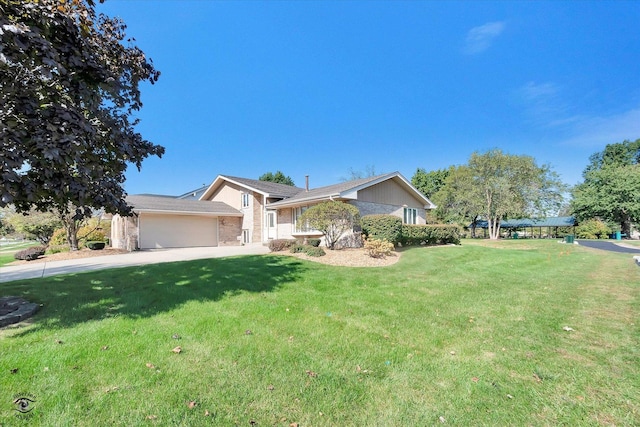 ranch-style home with driveway, brick siding, an attached garage, and a front yard