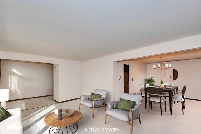 living room featuring baseboards and an inviting chandelier