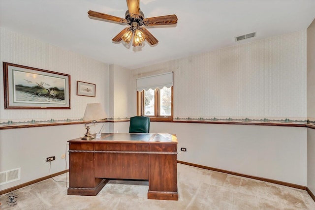 office area with light carpet, wallpapered walls, and visible vents