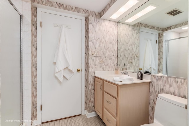 bathroom featuring toilet, wallpapered walls, visible vents, and vanity