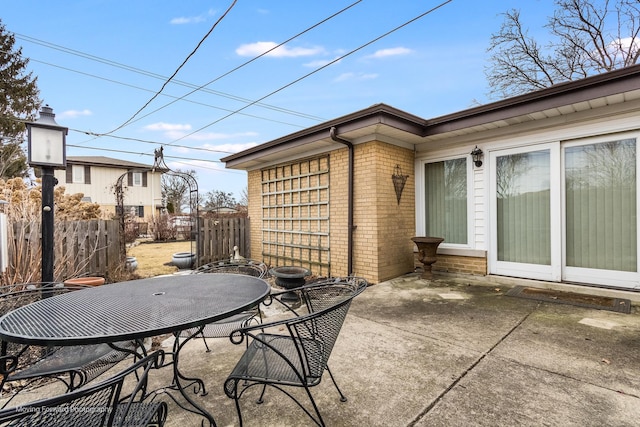 view of patio / terrace featuring outdoor dining area and fence