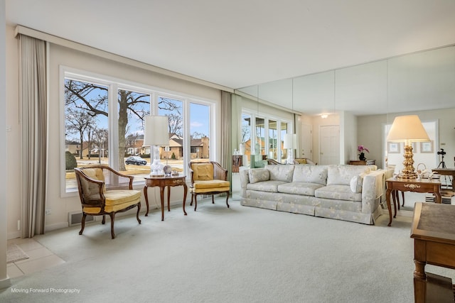 living room featuring visible vents and light colored carpet