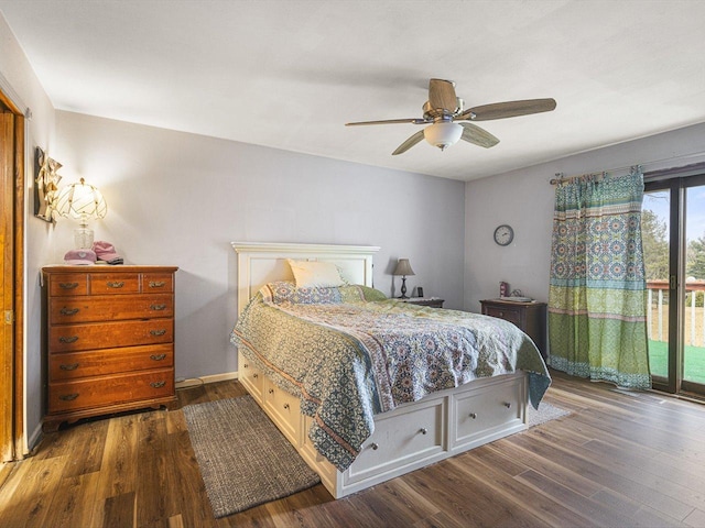 bedroom featuring dark wood-type flooring, access to outside, a ceiling fan, and baseboards