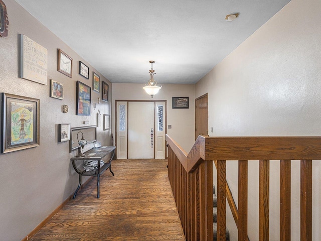 corridor with wood finished floors