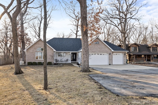 view of front of property featuring brick siding, a shingled roof, covered porch, driveway, and an attached garage