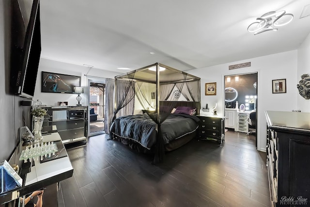 bedroom with dark wood-style floors