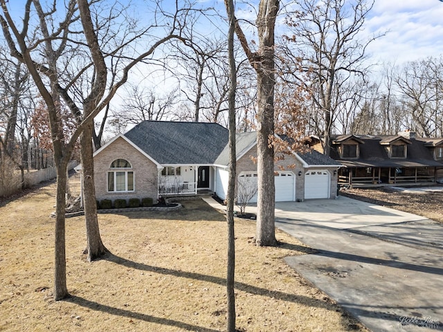 view of front of property with stone siding, a porch, roof with shingles, concrete driveway, and an attached garage