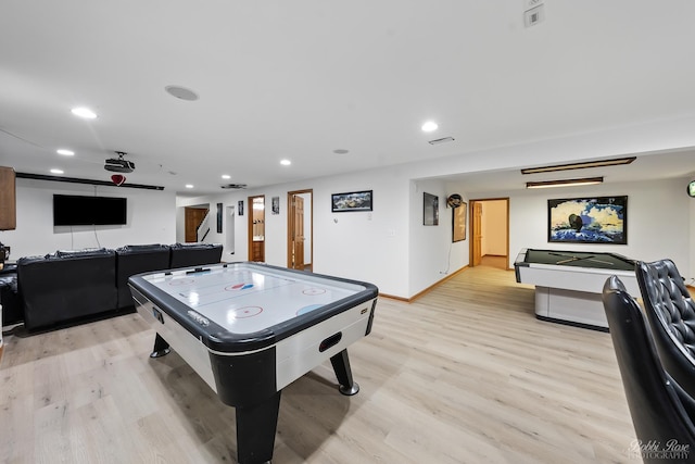 rec room with recessed lighting, visible vents, baseboards, and light wood finished floors