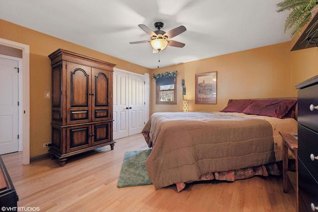 bedroom with a ceiling fan, light wood-type flooring, and a closet