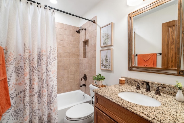 bathroom featuring shower / tub combo, vanity, and toilet