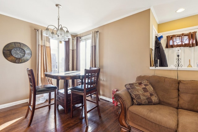 dining room with baseboards, ornamental molding, wood finished floors, a notable chandelier, and recessed lighting