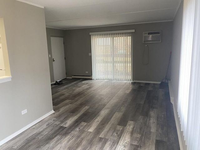 unfurnished room with an AC wall unit, a baseboard radiator, dark wood finished floors, and crown molding