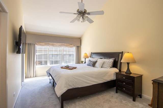 carpeted bedroom featuring a ceiling fan, high vaulted ceiling, and baseboards